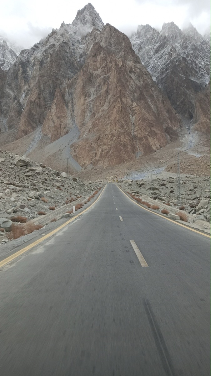 Karakoram Highway leading to dramatic mountain peaks
